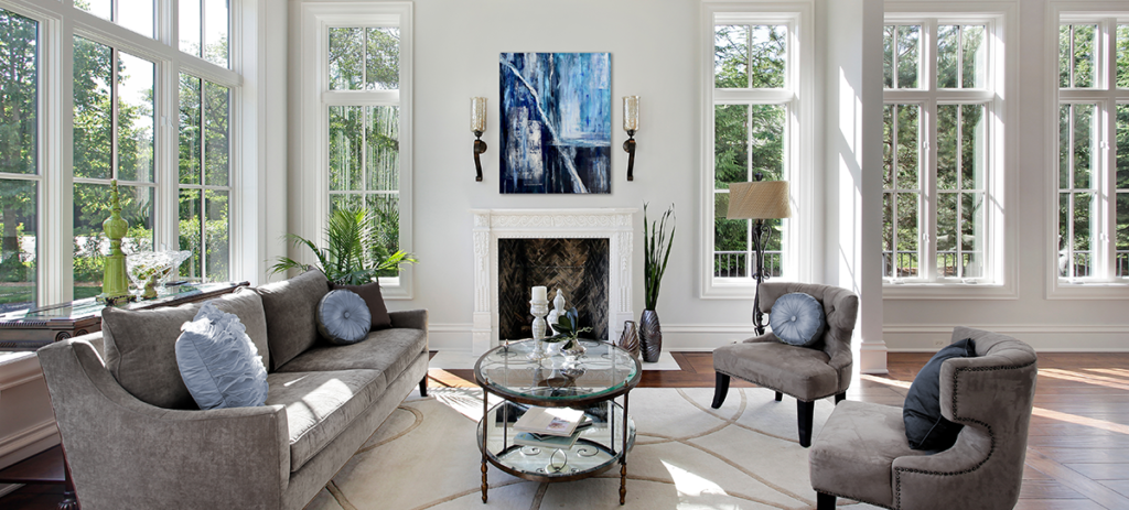 Susan Verekar modern abstract art above fireplace in bright sunny room